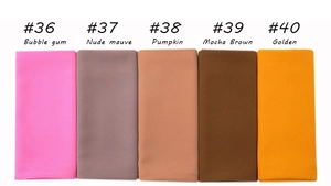 Close-up of five pleated pearl chiffon hijabs in bubblegum, mauve, pumpkin, mocha and gold