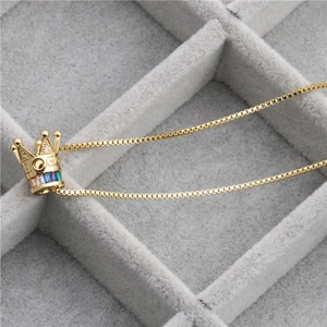 Golden copper necklace with crown pendant and multicolor micro-inlaid zircon gemstones