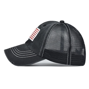 Distressed black cotton pony tail mesh cap with American flag embroidery at side view