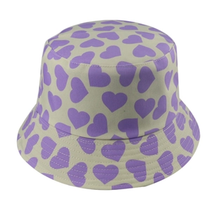 Close-up of purple heart print pattern on beige canvas sun hat with detailed stitching