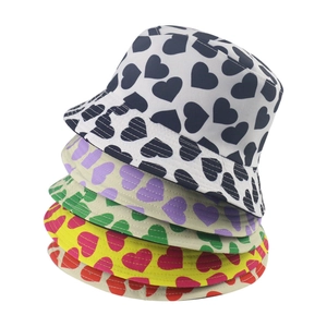 Casual summer bucket hats with all-over heart print patterns in five vibrant colors