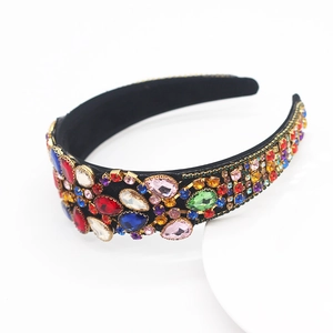Detailed macro view of vibrant colorful crystals on a luxurious baroque style black headband