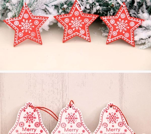 Detailed view of red star and white bell wooden Christmas tree ornaments with festive patterns