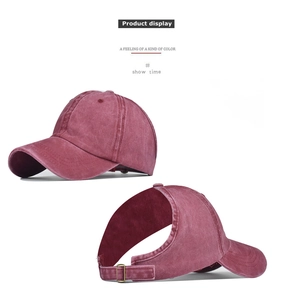 Detail of burgundy washed cotton ponytail cap with back opening and metal buckle