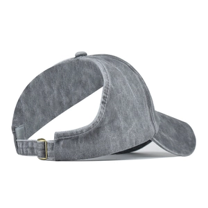 Detail view of washed gray ponytail baseball cap featuring rear opening and metal buckle