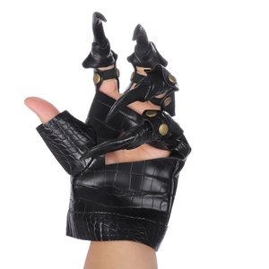 Detail of black dragon claw gloves with crocodile texture and metal rivets for cosplay