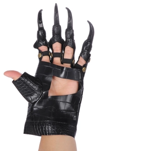 Close-up of dragon claw cosplay glove with black nails and crocodile skin texture