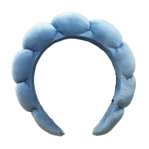 Macro view of thickened light blue sponge headband with soft plush velvet texture