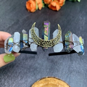 Detail of natural rainbow aura quartz crystals and crescent moon on bridal headband