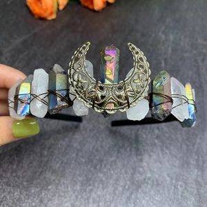 Detail of handmade rainbow crystal moon crown with bronze wire wrap and moon ornament