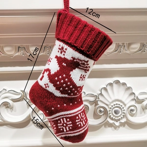 Knitted Christmas stocking with reindeer snowflake pattern and size dimensions 12x17x15cm