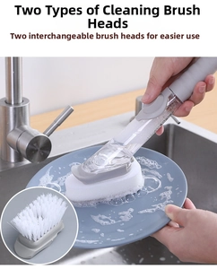 Macro shot showing kitchen dish brush with liquid soap dispenser and dual brush heads