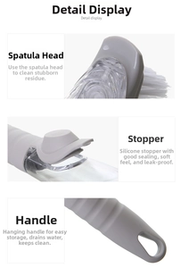Detail view of the dish brush scraper head, silicone sealing plug and hanging handle hole