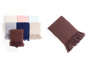 Close-up of stacked colorful polyester scarves with fringe detail and soft brushed texture