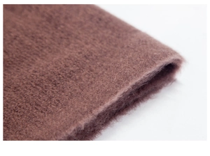 Macro shot of soft brown plush fabric texture and thick woven material detail