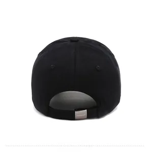 Detail view of the back of a black baseball cap with a branded metal adjustment buckle