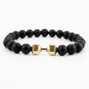 Detailed close-up of matte black beads with a golden dumbbell featuring LIFT engraving
