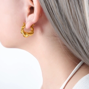Polished gold titanium steel twist hoop earrings in a French U-shape style for women