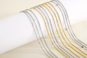 Detail of gold and silver layered link chains and satellite chains on a display stand