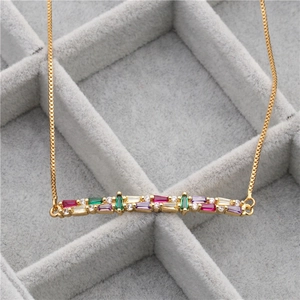 Detail of gold box chain necklace with colorful rectangular zircon stone pendant