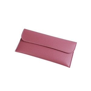 Minimalist long envelope wallet in dark pink lychee texture leather with fold-over flap