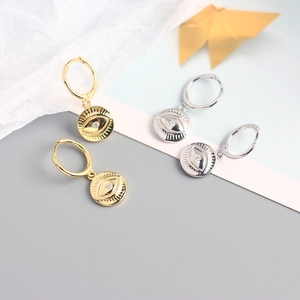 Detailed view of S925 sterling silver evil eye hoop earrings in gold and silver finish