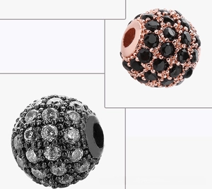 Macro view of 8mm micro-pave zircon beads in rose gold black and gunmetal finishes