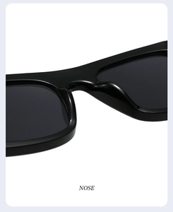 Macro shot of smooth integrated nose pads on black wide frame hip hop sunglasses