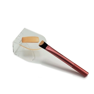 Square foundation brush with brown handle and transparent acrylic makeup mixing palette