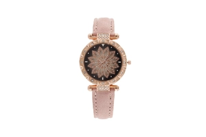 Macro detail of starry sky watch with pink suede strap and rhinestone flower dial