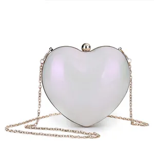 Elegant heart shaped acrylic evening bag with pearlescent finish and gold chain strap