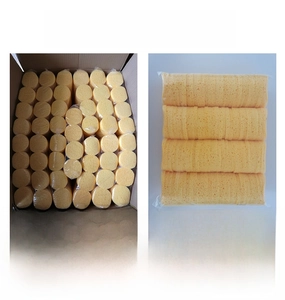 Close-up of 80x8mm round yellow cellulose facial sponges in bulk 120-piece pack