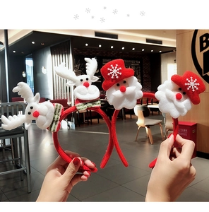 Detail of plush Christmas headband featuring reindeer and Santa Claus 3D ornaments