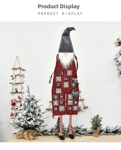 Close-up of Christmas gnome countdown advent calendar with 24 numbered date pockets