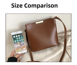 Brown leather bucket bag size comparison with smartphone and gold hardware detail