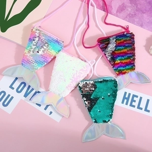 Detail of four sequin mermaid tail coin purses with lanyard and laser leather finish
