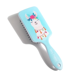 Detail view of light blue square air cushion hairbrush with cute cartoon alpaca pattern