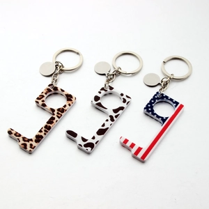 Acrylic no-touch door opener keychains with leopard, cow, and US flag patterns