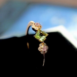 Exquisite peridot flower ring in rose gold with square green stone and pink floral accents