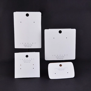 White jewelry display cards with 925 silver post text on a black background