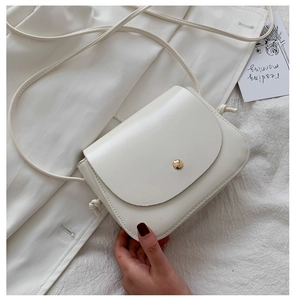 Minimalist cream white PU leather crossbody bag with metal snap button on fabric