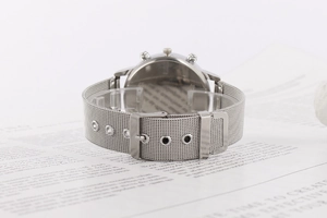 Detailed back view of silver mesh band watch showing secure clasp and metal casing