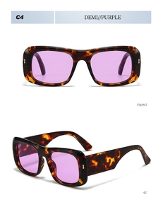 Detail view of retro thick frame sunglasses in demi color with purple lenses