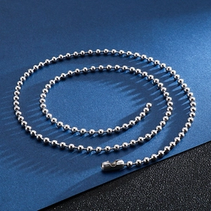 Polished silver stainless steel ball chain necklace for men and women on a dark background