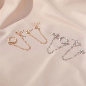 Elegant gold and silver long chain earrings with geometric U-shape and moon snake motifs