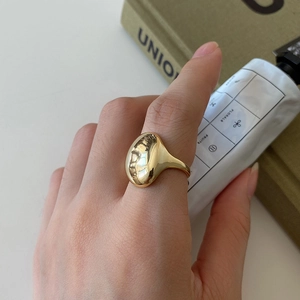 French style 925 sterling silver golden irregular ring worn on model with minimalist aesthetic