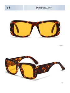 Detail view of demi frames with yellow lenses and retro wide rectangle sunglasses design