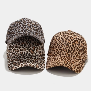 Close-up detail of leopard print baseball caps in grey and classic tan patterns