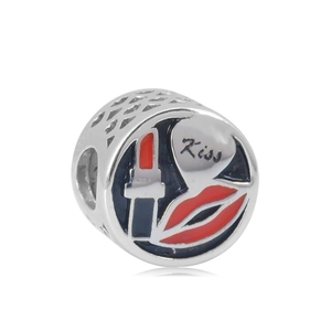 Macro detail of silver bead with enamel heart patterns and Kiss lettering for DIY bracelets