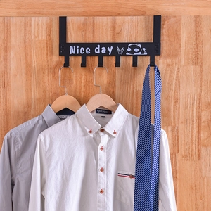 Detail of black panda over-the-door hook rack with six hooks holding shirts and tie